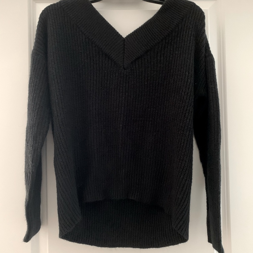 Off-the-shoulder black sweater